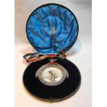 Curling - impressive silver medal, 'London Scottish' with embossed figure of a competitor within a