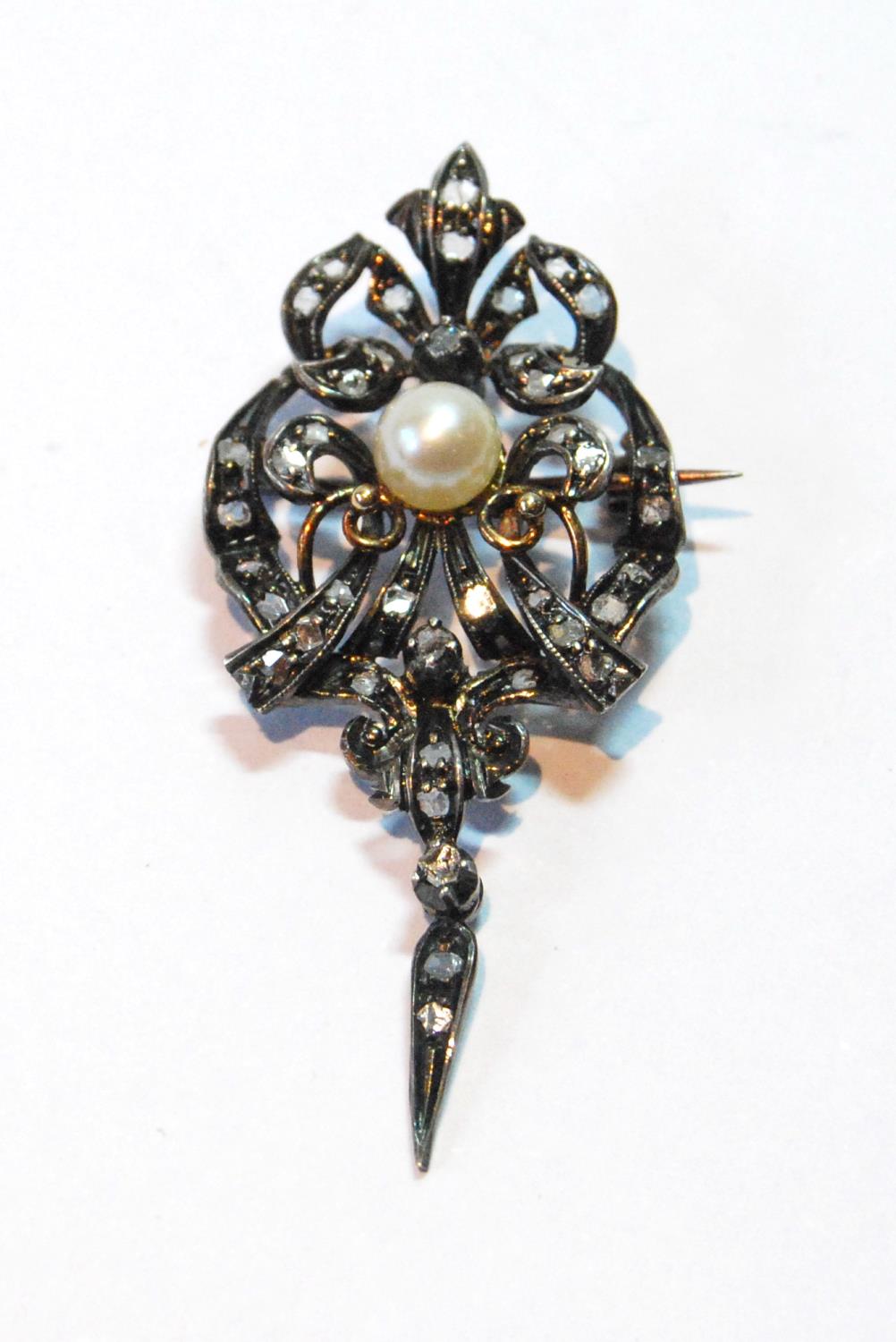 Early Victorian brooch/pendant with a pearl and rose diamonds, in gold fronted with silver.