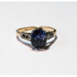 Sapphire ring with Ceylon hued stone approximately 9mm x 7mm x 7mm deep with diamond-set