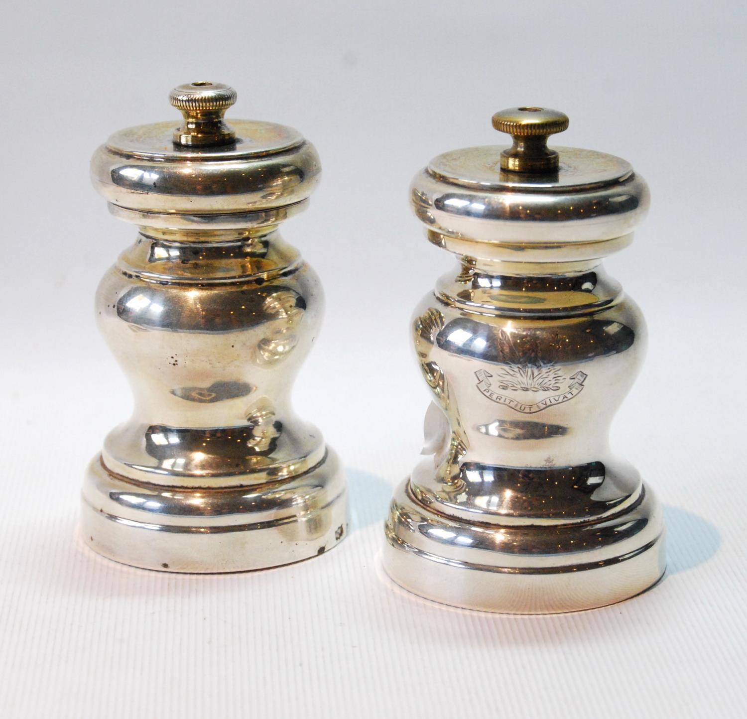 Pair of silver baluster pepper mills, crested, by Mappin & Webb, Birmingham 1914, gross 9½oz.