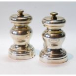 Pair of silver baluster pepper mills, crested, by Mappin & Webb, Birmingham 1914, gross 9½oz.