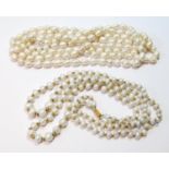 Two-row pearl necklace on gold snap and another, opera length.