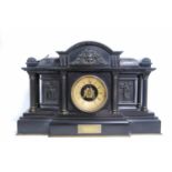 Late Victorian slate Palladian mantel clock with arched pediment, mask frieze over brass chapter