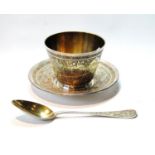 French silver gilt porringer, stand and spoon engraved with arabesques, flowers and scrolls,