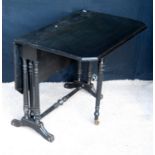 Victorian ebonised Sutherland table, the moulded rectangular top with canted corners, raised on