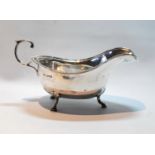 Silver sauce boat with gadrooned edge and flying scroll handle, Sheffield 1933, 5oz.