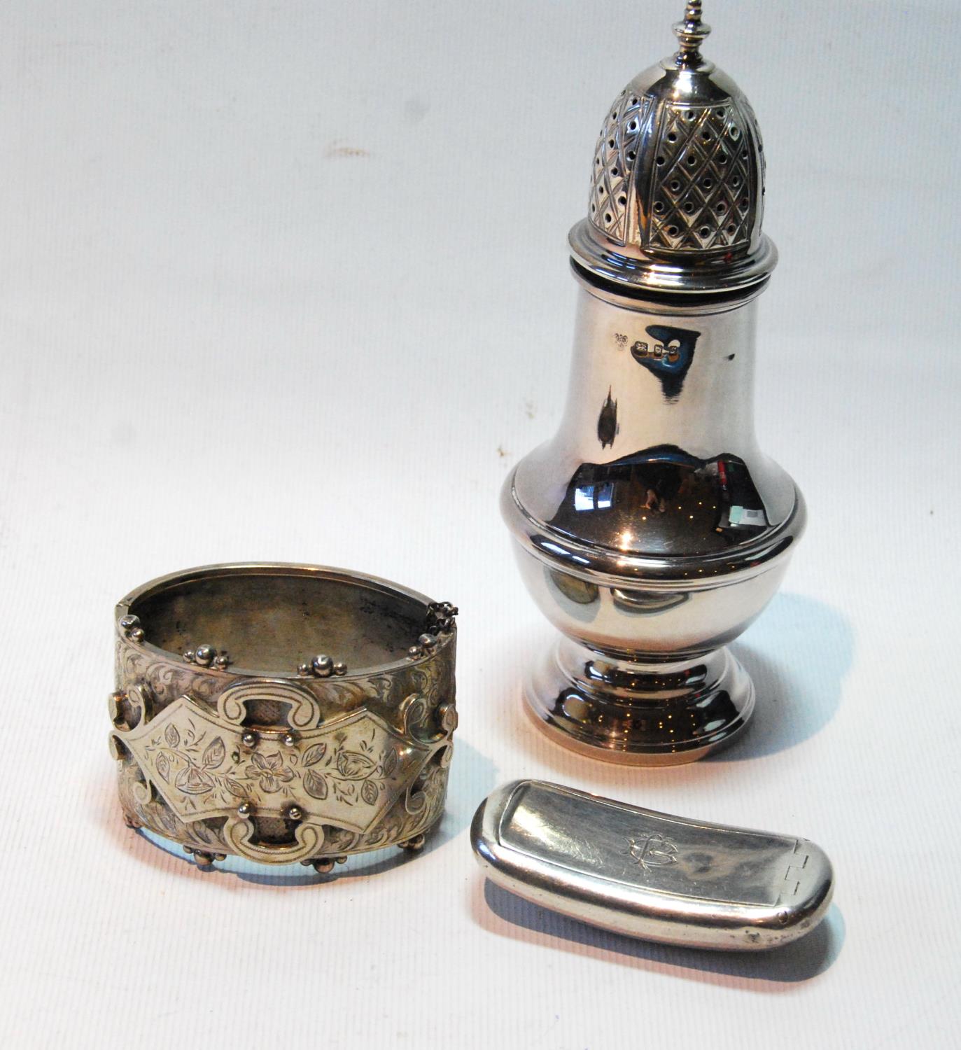 Silver baluster caster by Vanders, 1973, a Victorian engraved silver bangle and a snuff box of