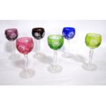 Set of six coloured glass wine glasses, each with star design, 17cm high.