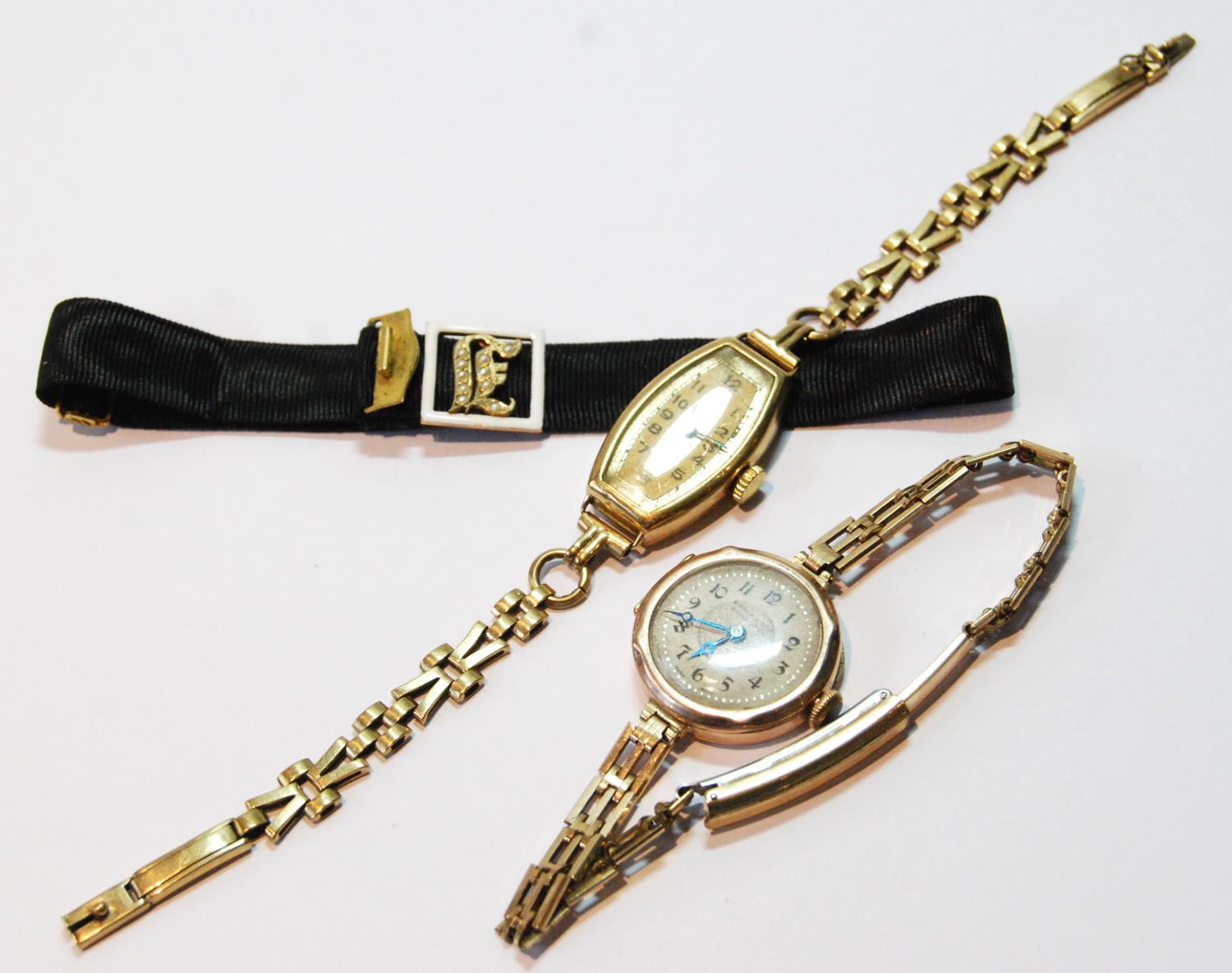 Lady's 9ct gold bracelet watch, another on rolled gold bracelet, and a gold-mounted initial