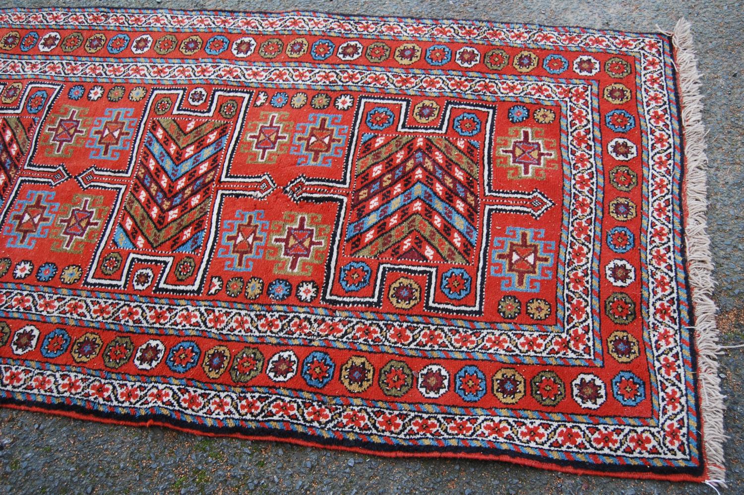 Kurdish Quchan rug with three H panels with arrows over orange ground, all over guls and rosettes, - Image 2 of 3