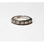 Diamond seven-stone ring of half eternity style with brilliants, each approximately .15ct, in