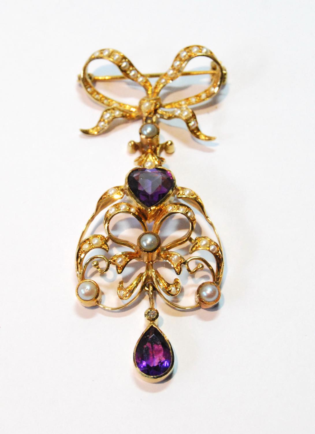 Gold brooch/pendant with amethyst and pearl drop dependant from a pearl-set bow, probably 15ct.