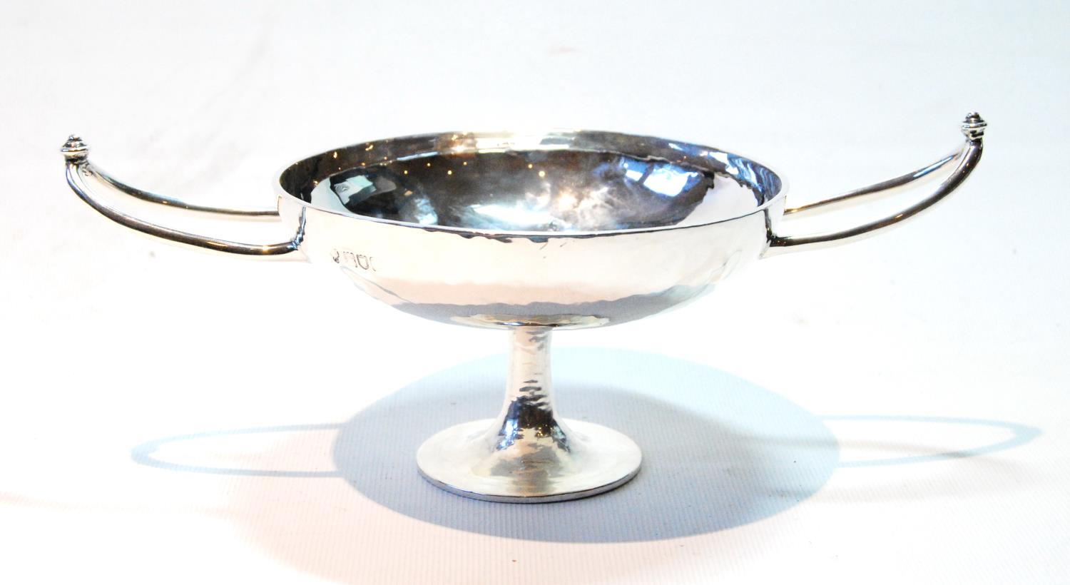Silver hammered tazza of Art Nouveau style with slender pointed knopped handles on spreading foot,