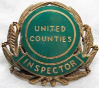 United Counties Omnibus Company enamel-on-brass CAP BADGE 'Inspector' with laurel leaf surround.
