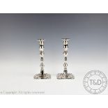 A pair of George III style silver candlesticks, C J Vander Ltd, Birmingham 1963,