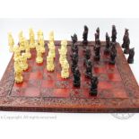 A contemporary Chinese moulded chess set,
