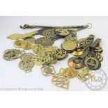 A selection of vintage horse brasses, various designs, some with leather back plates,