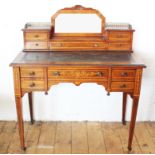 An Edwardian inlaid rosewood writing table in the manner of Edwards and Roberts,