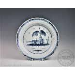 An 18th century Delft ware blue and white charger,