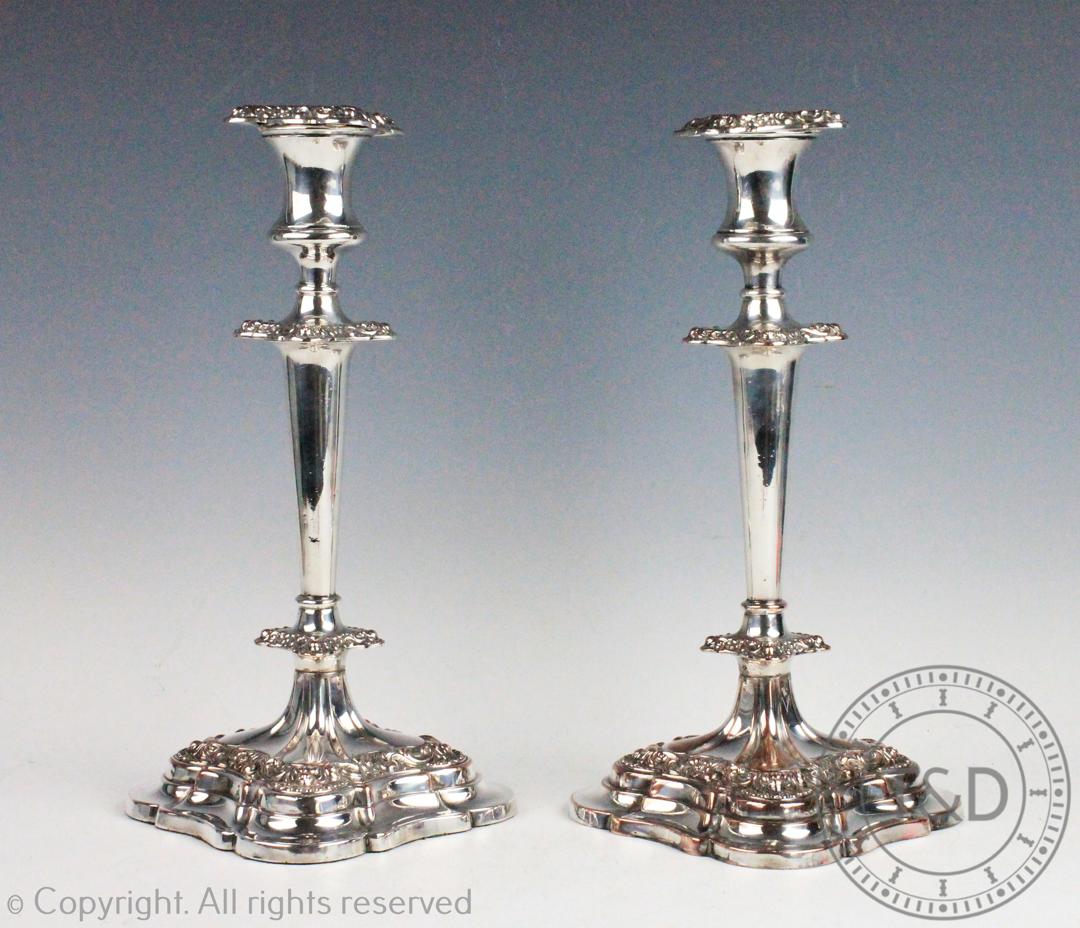 A pair of Old Sheffield silver plated candlesticks,