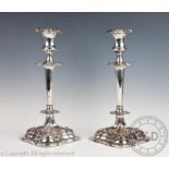A pair of Old Sheffield silver plated candlesticks,