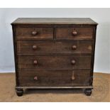 A late George III oak chest, with two short and three graduated long drawers, with panelled sides,