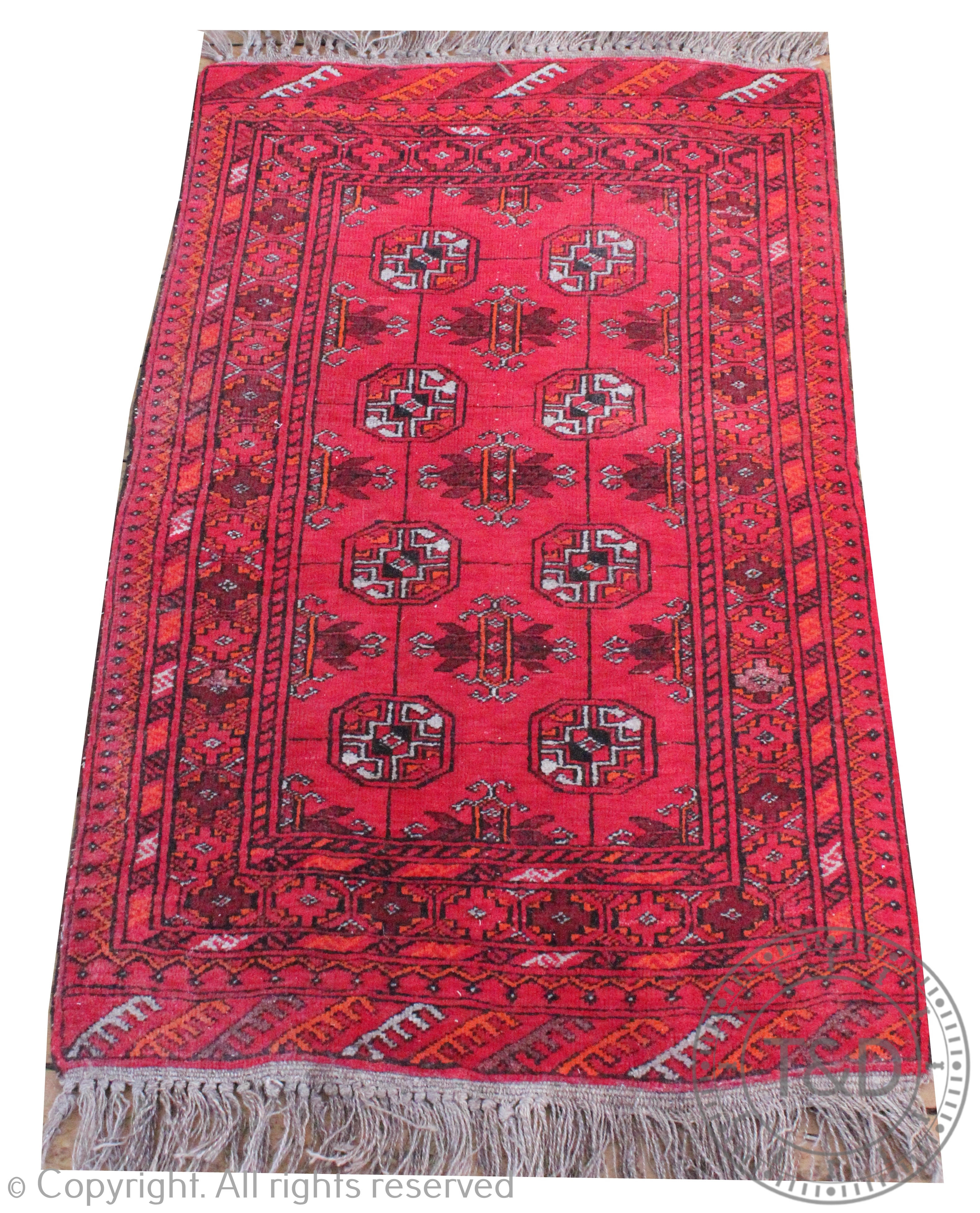 A Baluch type wool rug, worked with eight gulls against a red ground, 112cm x 70cm,