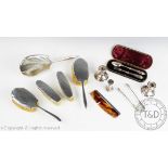 A collection of silver wares, comprising; a silver backed dressing table set,