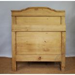 A continental pine single bed, with panelled head and footboard's,