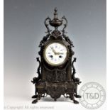 A late 19th century French bronzed mantel clock,