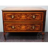 An Edwardian inlaid mahogany chest of drawers, the top drawer stamped 'Jas Shoolbred & Co',