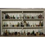 A collection of 19th century and later glass and stoneware bottles and jars,