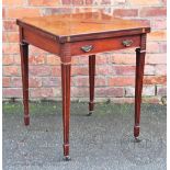 An Edwardian mahogany envelope card table, with drawer, on fluted and tapered legs,