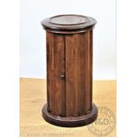 A late Victorian walnut cylindrical wash pot cupboard,