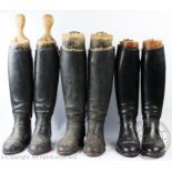 Three pairs of black leather riding boots and trees, two pairs stamped for T.