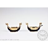 A pair of Norwegian silver and enamel salts each modelled as a Viking ship,
