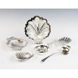 A collection of silver, to include; a near pair of silver shell shaped salts, 9.