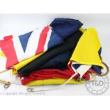 Nine assorted cotton flags to include a Union Jack, Spanish flag,