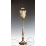 A brass table lamp modelled as a street lamp,