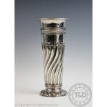 A silver vase Sibray, Hall & Co Ltd, London 1894 of half wrythen form,