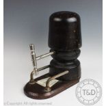 A milliners vintage wooden hat stretcher, with head circumference panel,