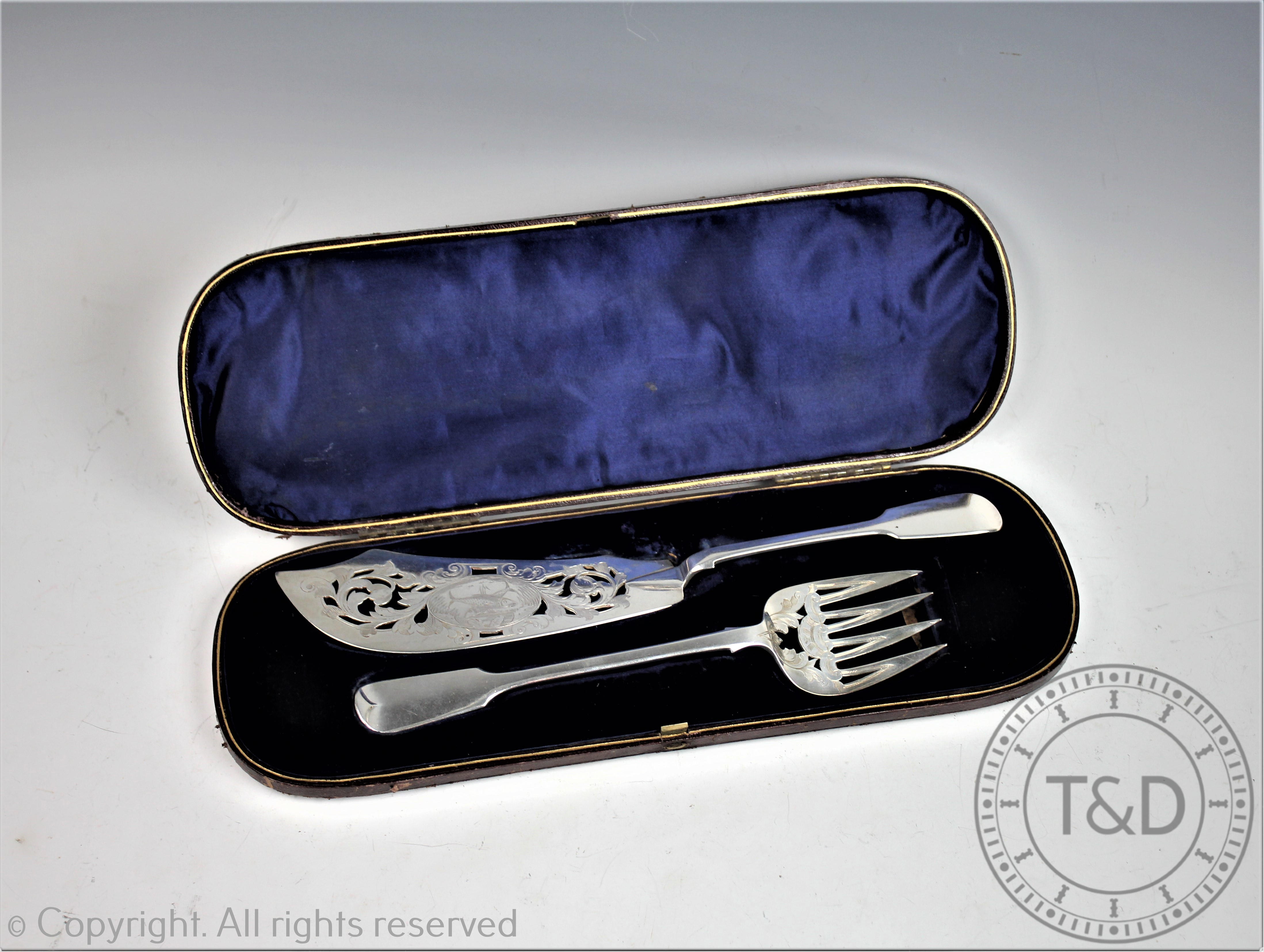 A pair of silver Victorian fish servers, H J Lias & Son, London 1862,