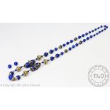 A simulated lapis lazuli Indian necklace with a pair of matching earrings and a malachite cabochon