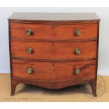 A late George III mahogany bow front chest, with three long drawers, on splayed bracket feet,
