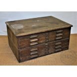 An early 20th century oak plan chest, with six long drawers,