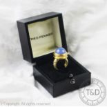 A Theo Fennell 18ct gold and blue chalcedony coloured cabochon stone set ring,