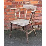 A 19th century ash and elm Captain's type chair, with solid seat, on turned legs, faded,