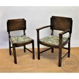 A set of four 1940's oak dining chairs, including two with arms,