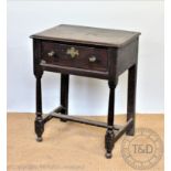 A late George III oak desk, with single deep drawer, on turned legs,