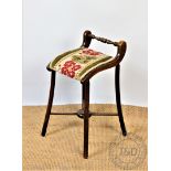A late 19th century stained beech harpists chair / music stool, with tapestry seat, on splayed legs,